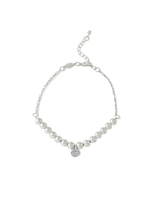 Pulseira de bolas com pingente de gota em zircônia banhada a prata 925 da UNA Semijoias e Aço em fundo branco, em vista frontal.