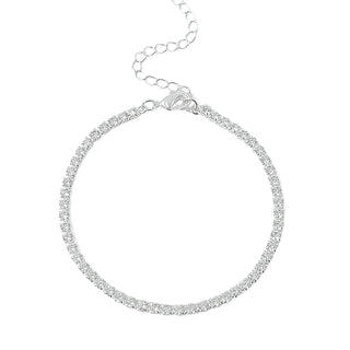 Pulseira riviera transparente banhada a prata 925 da UNA Semijoias e Aço em fundo branco, com extensor ajustável e fileira de pedras brilhantes.